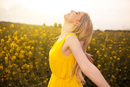 Young beautiful woman in the fieldsの写真素材