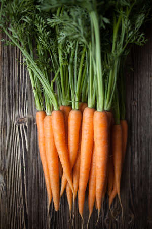 Carrot on wooden tableの写真素材