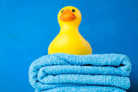 Soft blue towels and a toy duckの写真素材