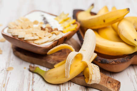 Banana yoghurt with seeds and cornflakesの写真素材