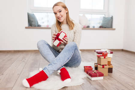 Teenage girl with Christmas presents