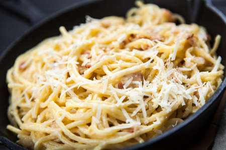 Spaghetti carbonara with egg and pancettaの写真素材