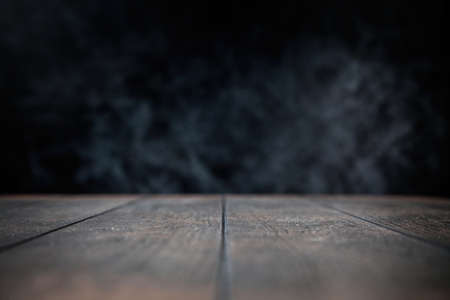 Wooden table on concrete wall backgroundの写真素材