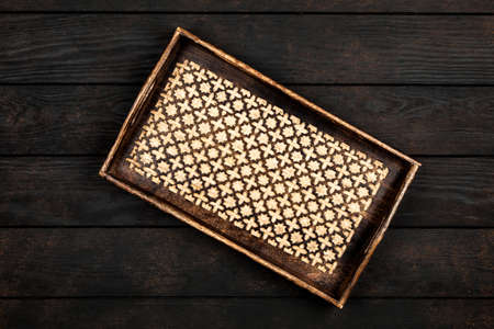 Wooden tray on a tableの写真素材