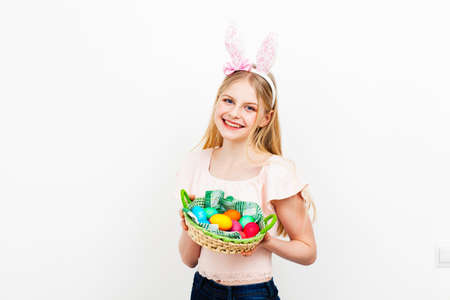 Teenage girl holding Easter eggs