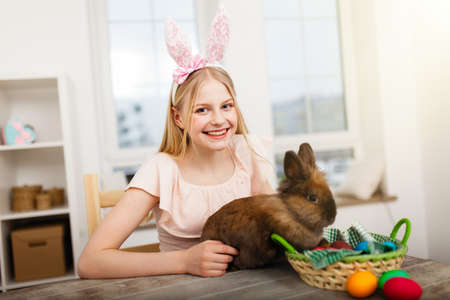 Teenage girl holding Easter eggs