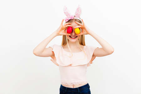 Teenage girl holding Easter eggsの写真素材