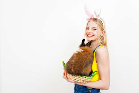 Teenage girl holding Easter eggs