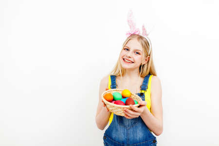 Teenage girl holding Easter eggsの写真素材
