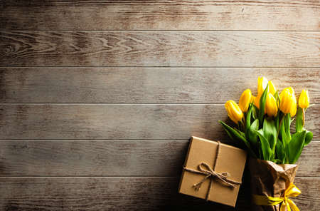 Yellow tulips on wooden backgroundの写真素材