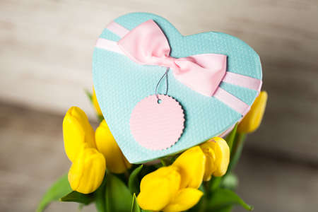 Yellow tulips on wooden backgroundの写真素材