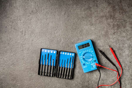 Digital multimeter on grey backgroundの写真素材