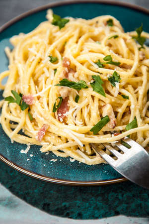 Spaghetti carbonara with egg and pancettaの写真素材