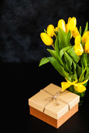 Yellow tulips on dark backgroundの写真素材