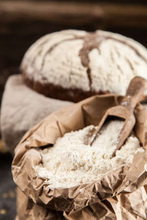 Bag of flour on wooden table