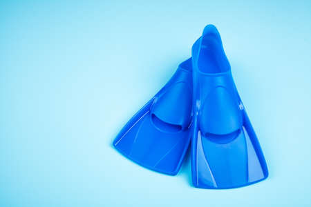 Blue flippers on color backgroundの写真素材