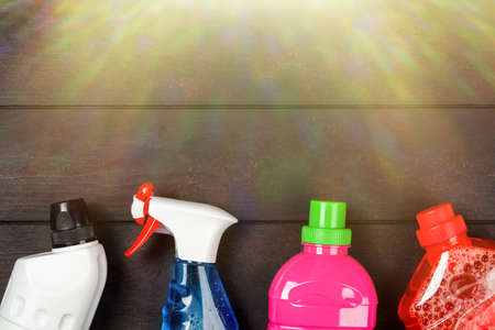 Cleaning supplies on wooden backgroundの写真素材