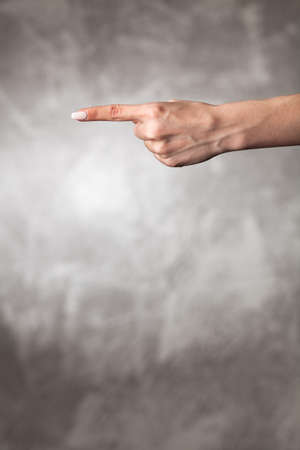 Female hand on dark background