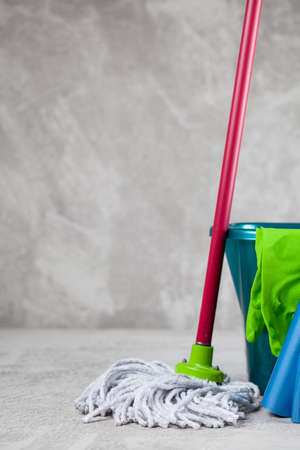 Cleaning supplies on grey backgroundの写真素材