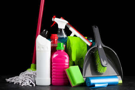 Cleaning supplies on black backgroundの写真素材