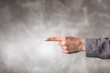Female hand on dark background