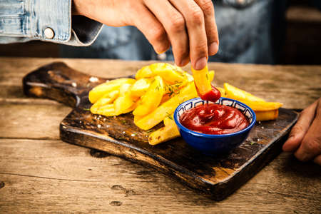 French fries on wooden table