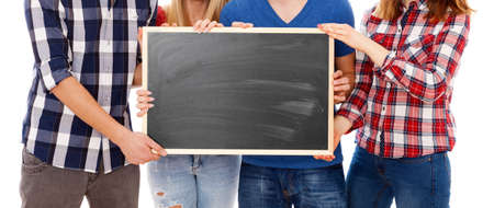Group of happy young people with a blackboard