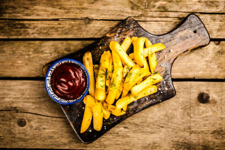 French fries on wooden tableの写真素材