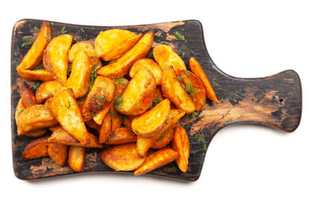 Baked potato fries on wooden table
