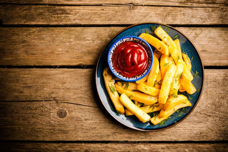 French fries on wooden tableの写真素材