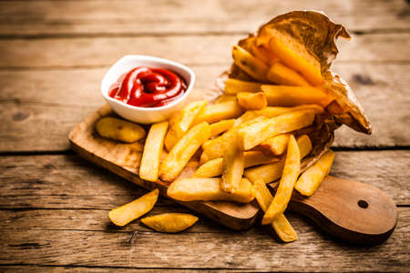 French fries on wooden table