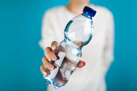 Woman holding a water bottle