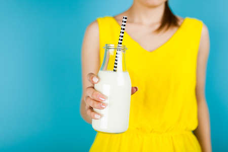 Woman holding a bottle of milk