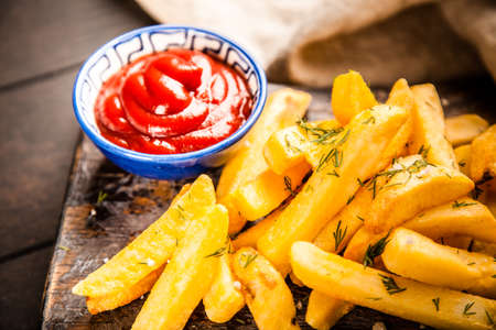 French fries on wooden tableの写真素材