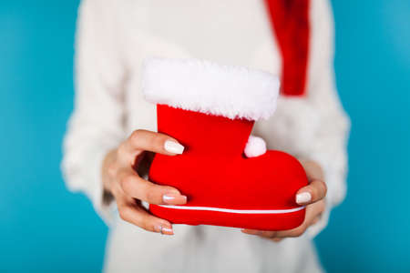 Woman holding Santas shoeの写真素材