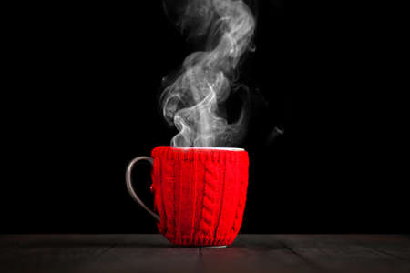 Coffee mug in a wool coverの写真素材