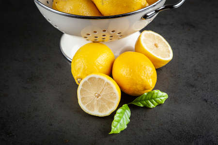 Fresh lemons with green leaves