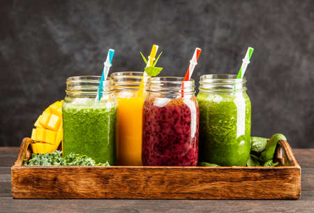 Assortment of green detox and fruit smoothiesの写真素材