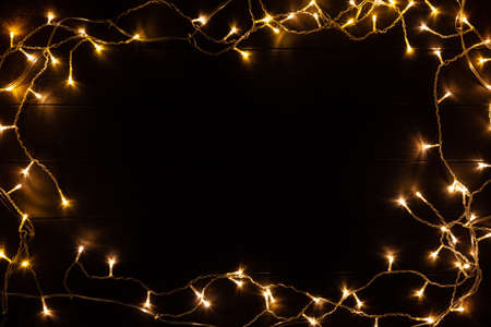 Christmas lights on wooded backgroundの写真素材