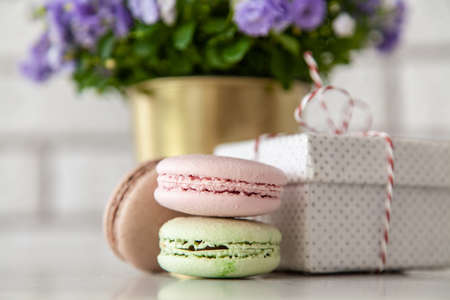 Macarons, gift boxes and flowersの写真素材