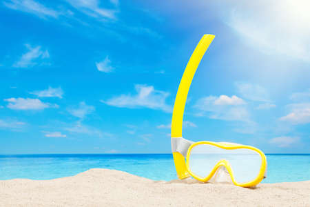 Snorkeling equipment on a sandy beachの写真素材