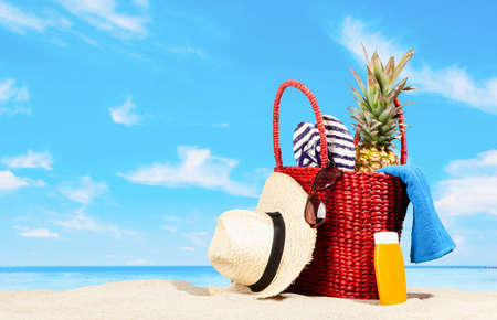 Red beach bag with accessoriesの写真素材