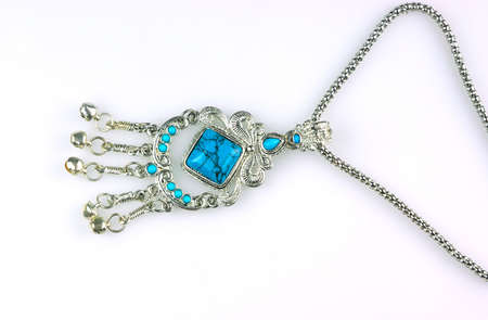 Closeup blue necklace on white backgroundの写真素材