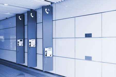 three signs and public telephoneの写真素材