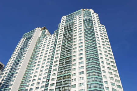 very high apartment in blue skyの写真素材