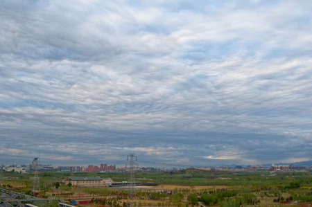 landscape of spring environs with cloudy skyの写真素材