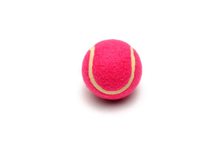 Pink tennis ball isolated on whiteの写真素材