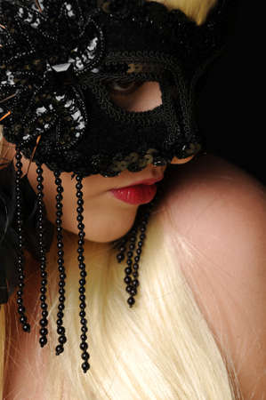 Beautiful blonde women in black mask