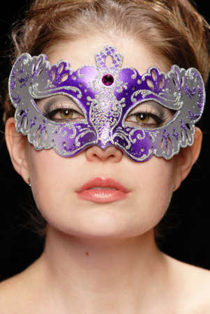 Headshot of a beautiful woman in a maskの写真素材