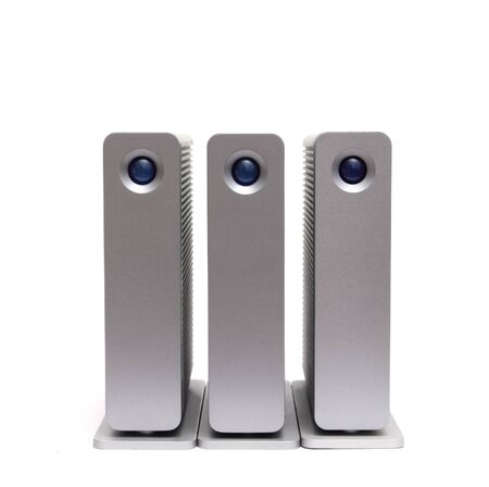 three external hard disks on a white backgroundの写真素材